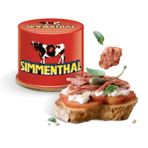 Confezione di Spimmenthal e fetta di pane con la carne, un cappero, pomodoro e mozzarella